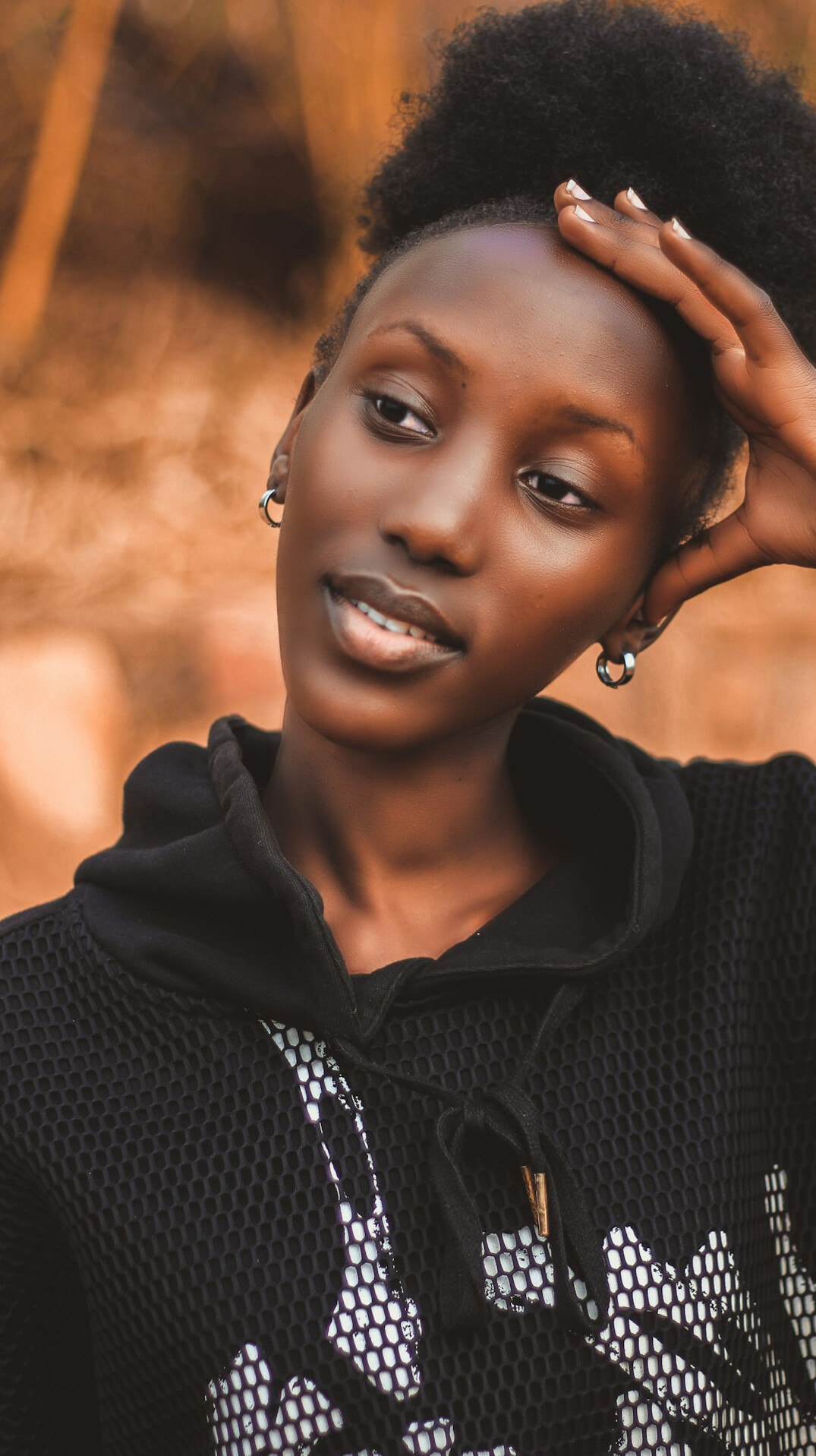 Portrait of a smiling Black woman with natural hair