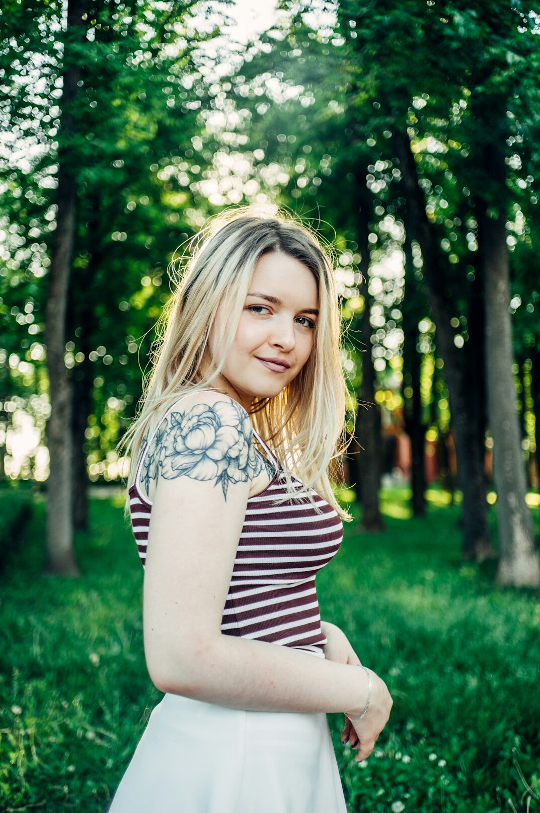 Portrait of a smiling woman with shoulder-length blonde hair