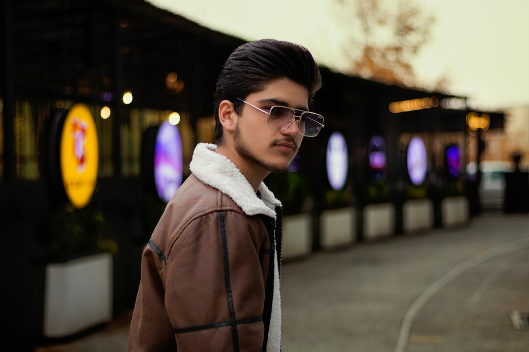 Portrait of a young man of South Asian descent with glasses
